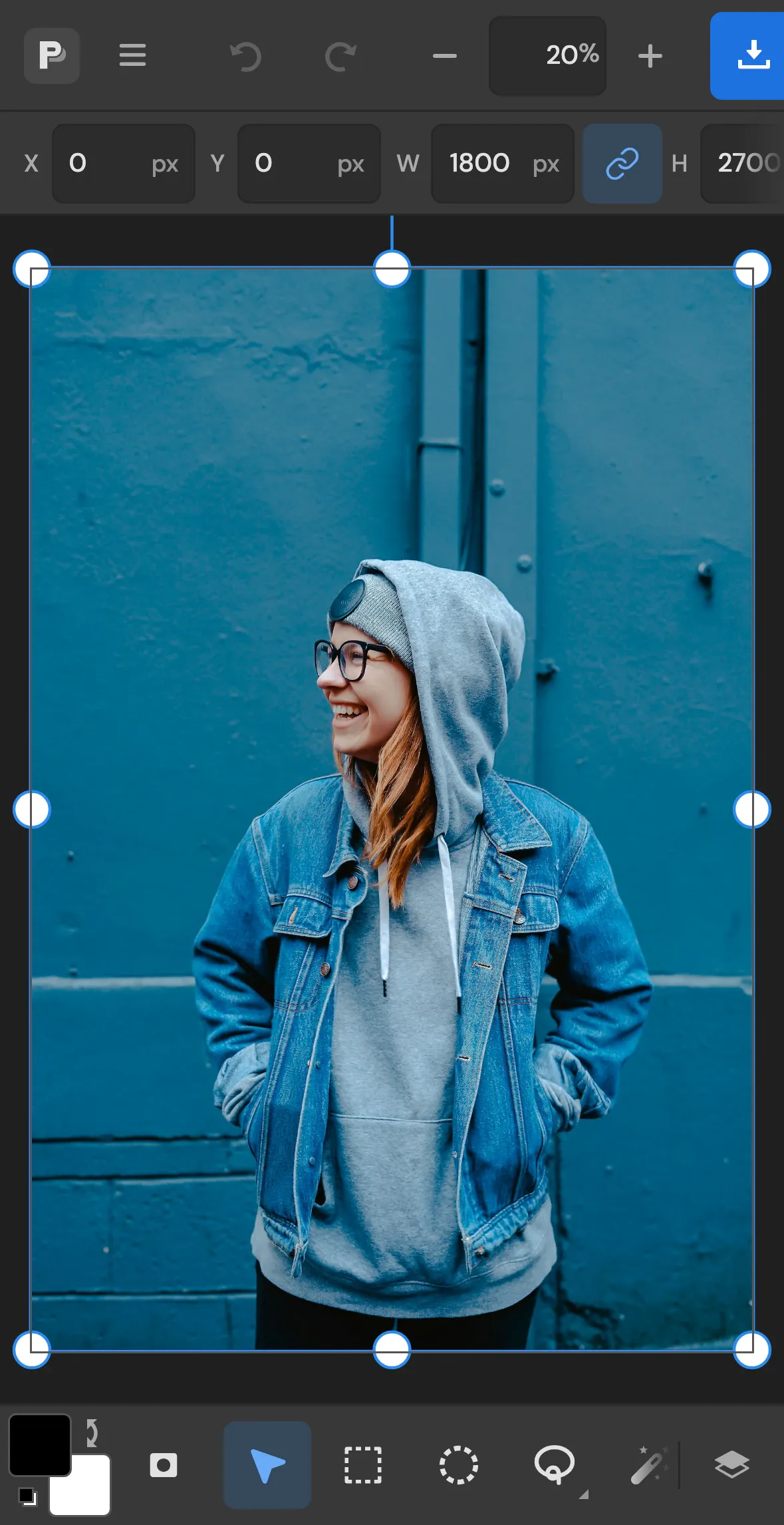 The editor on an iPhone with a portrait photo open and the tool dock at the bottom of the screen